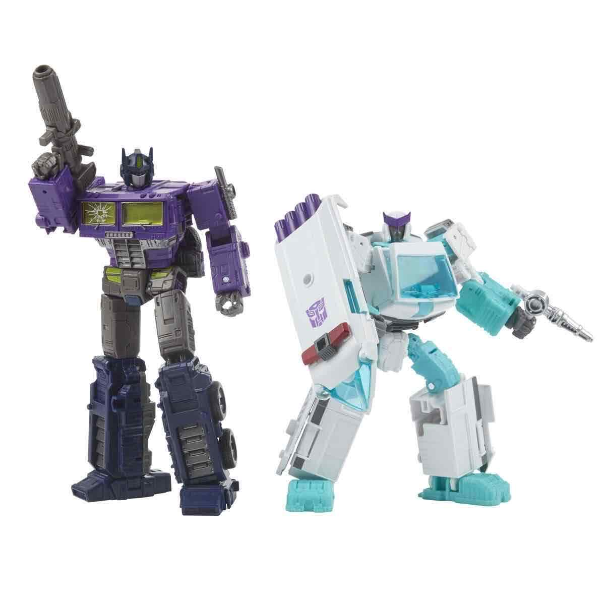 Transformers Generations Selects Shattered Glass Optimus Prime & Ratchet in hand
