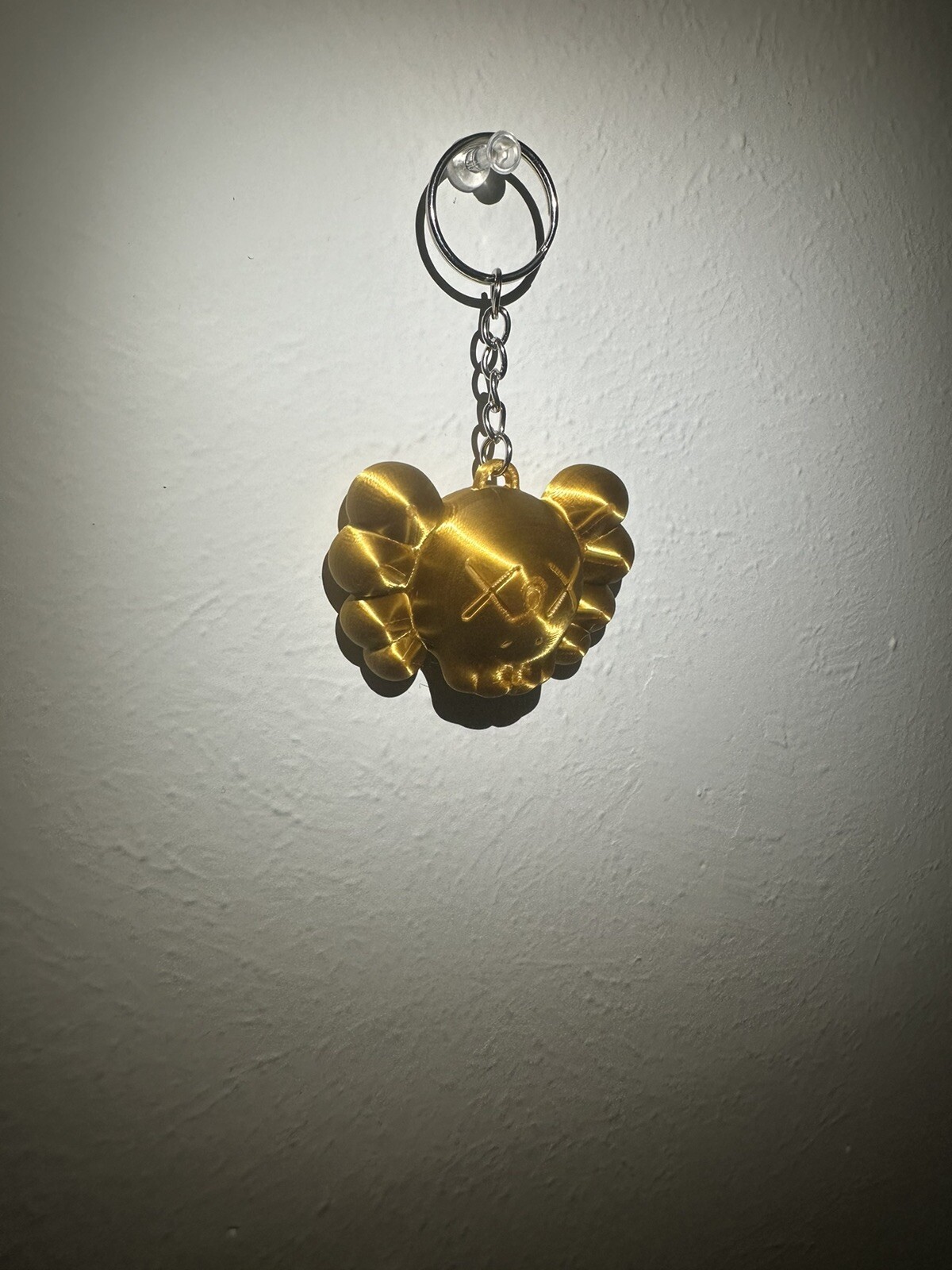 KAWS “Chum” Figure Keychain – Gold