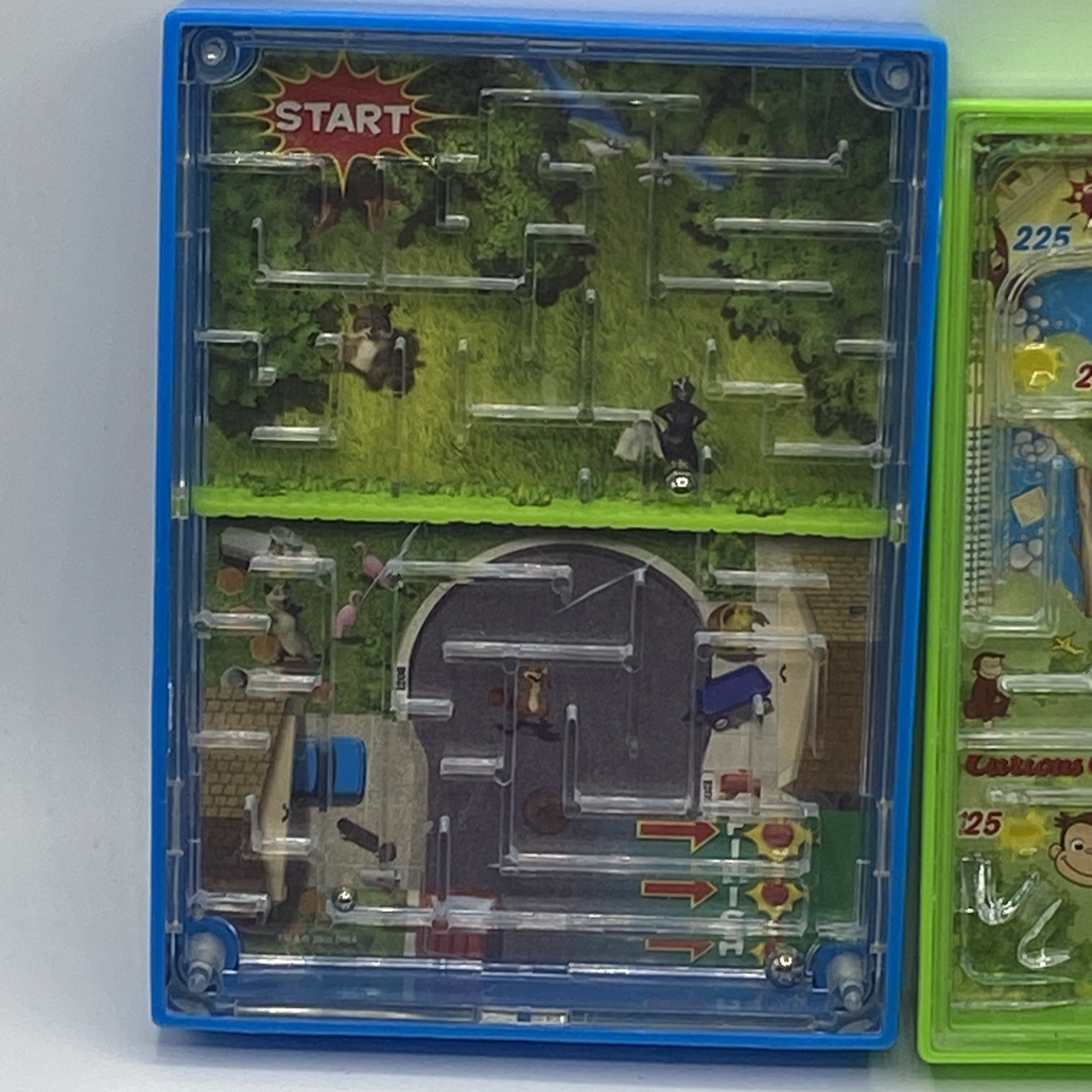 UIVERSAL STUDIOS CURIOUS GEORGE Monkey Maze Handheld Game & Over The Hedge
