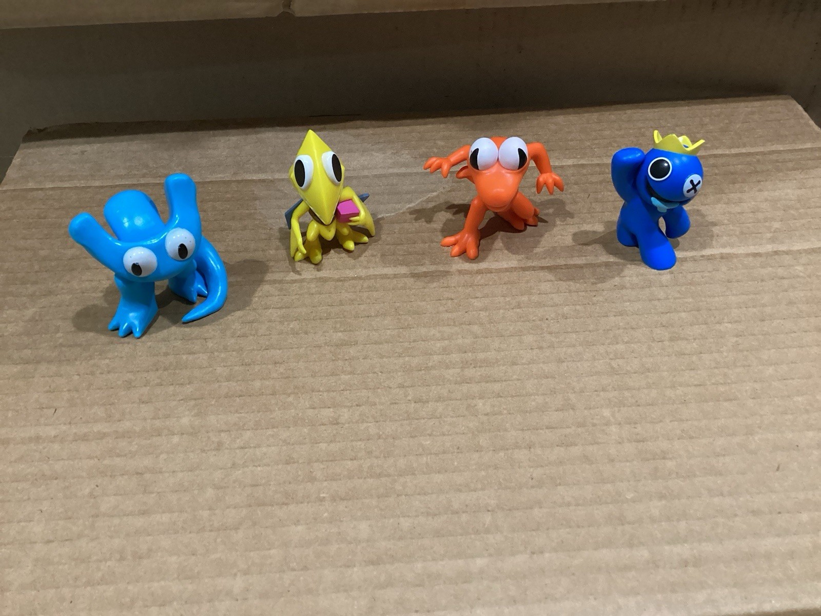 Rainbow Friends minifigures (4) Yellow , Orange, Dark Blue, Light Blue 2 1/4”