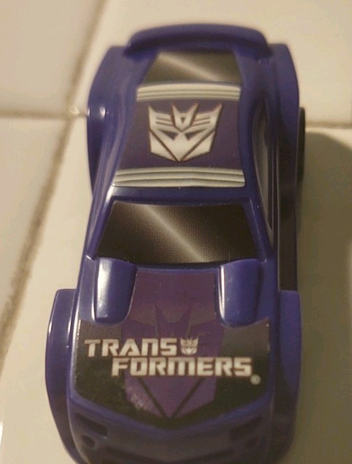 HASBRO 2011 PURPLE TRANSFORMERS LOOSE PLASTIC MODEL CAR DECEPTICON! L36