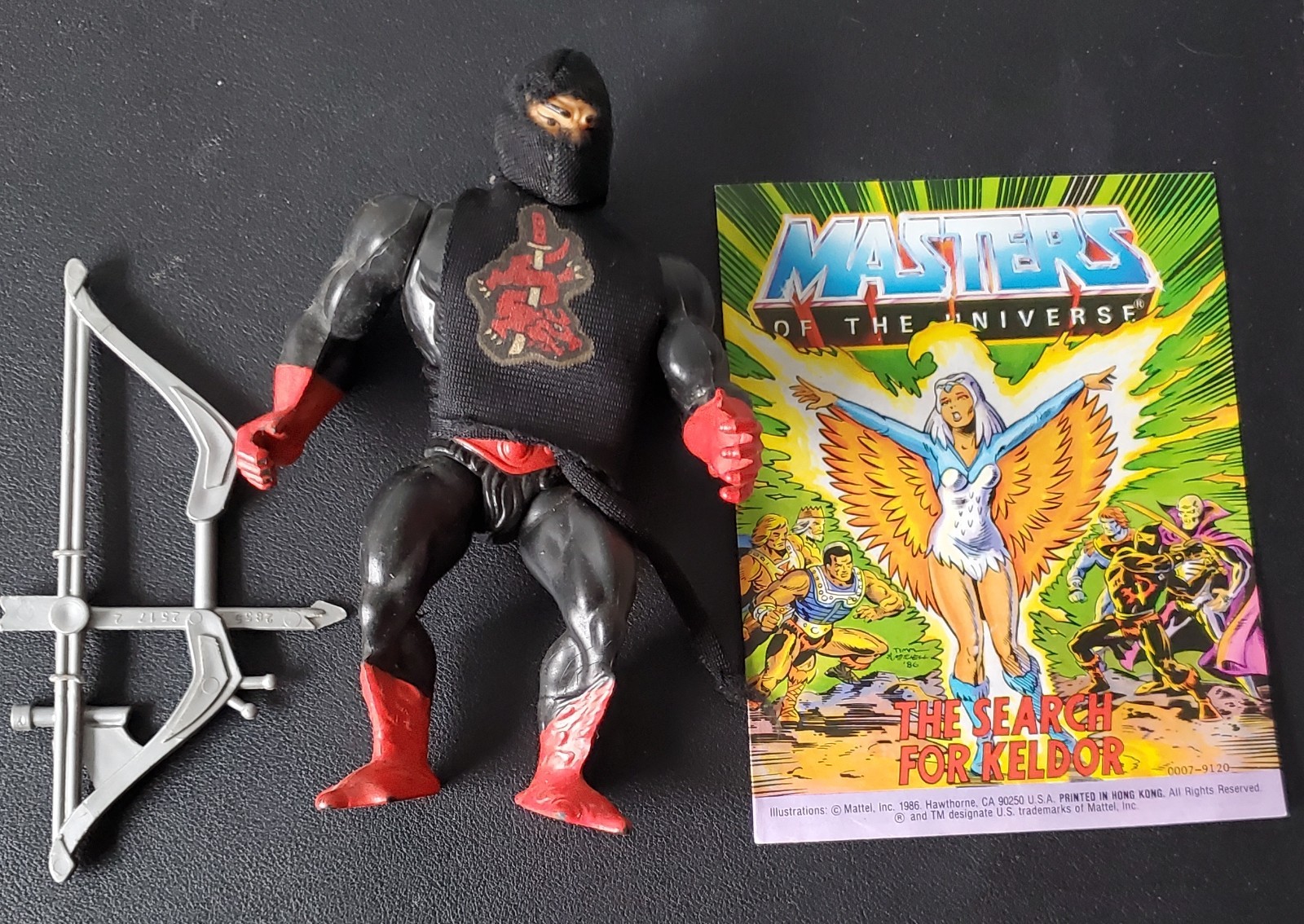 Evil Warrior Ninjor vintage Masters of the Universe with bow and mini comic