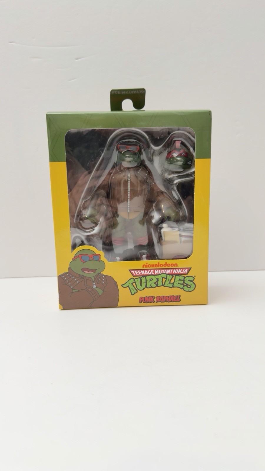NECA TMNT Punk Raphael Action Figure, Green/Brown/Red w/ Heads Hands Bag