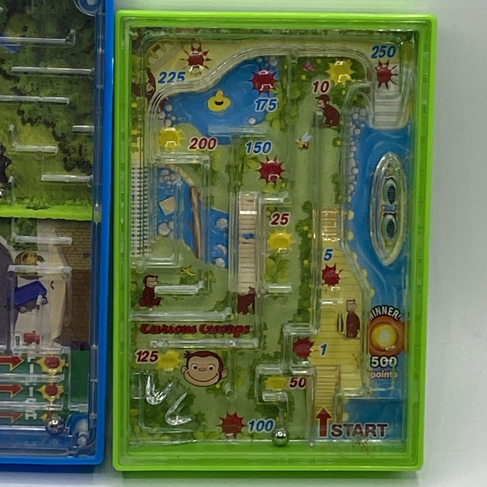 UIVERSAL STUDIOS CURIOUS GEORGE Monkey Maze Handheld Game & Over The Hedge