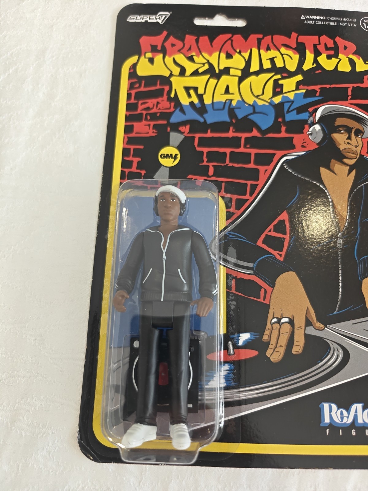 Grandmaster Flash Collectible 4&Prime; ReAction Figure with Accessory Black Age 14+