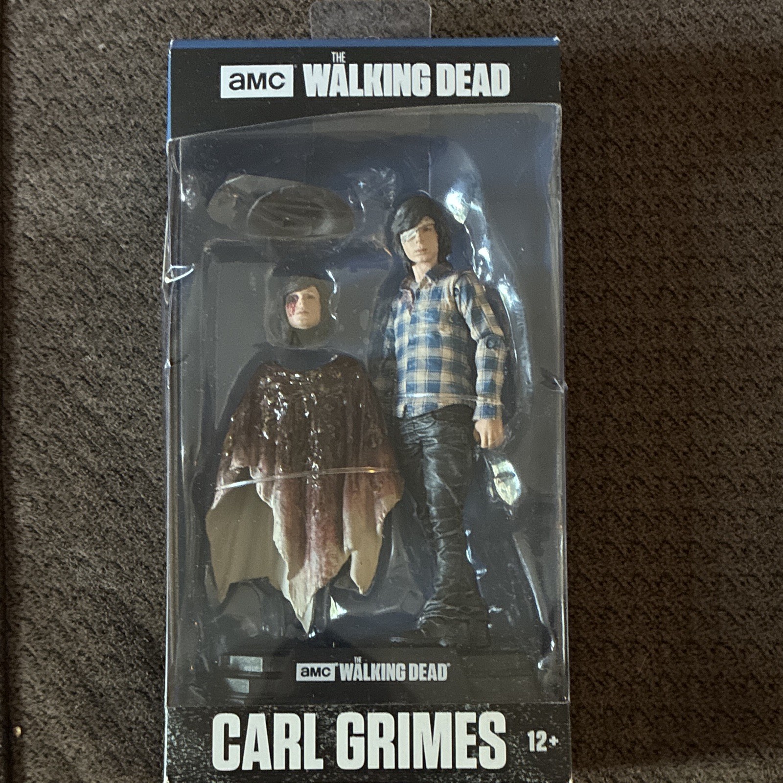 McFarlane Toys The Walking Dead Carl Grimes Action Figure new in box good cond.