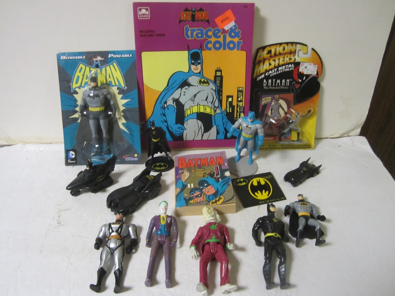 misc lot of 15 Batman joker batgirl robin figures, books, pins, cars
