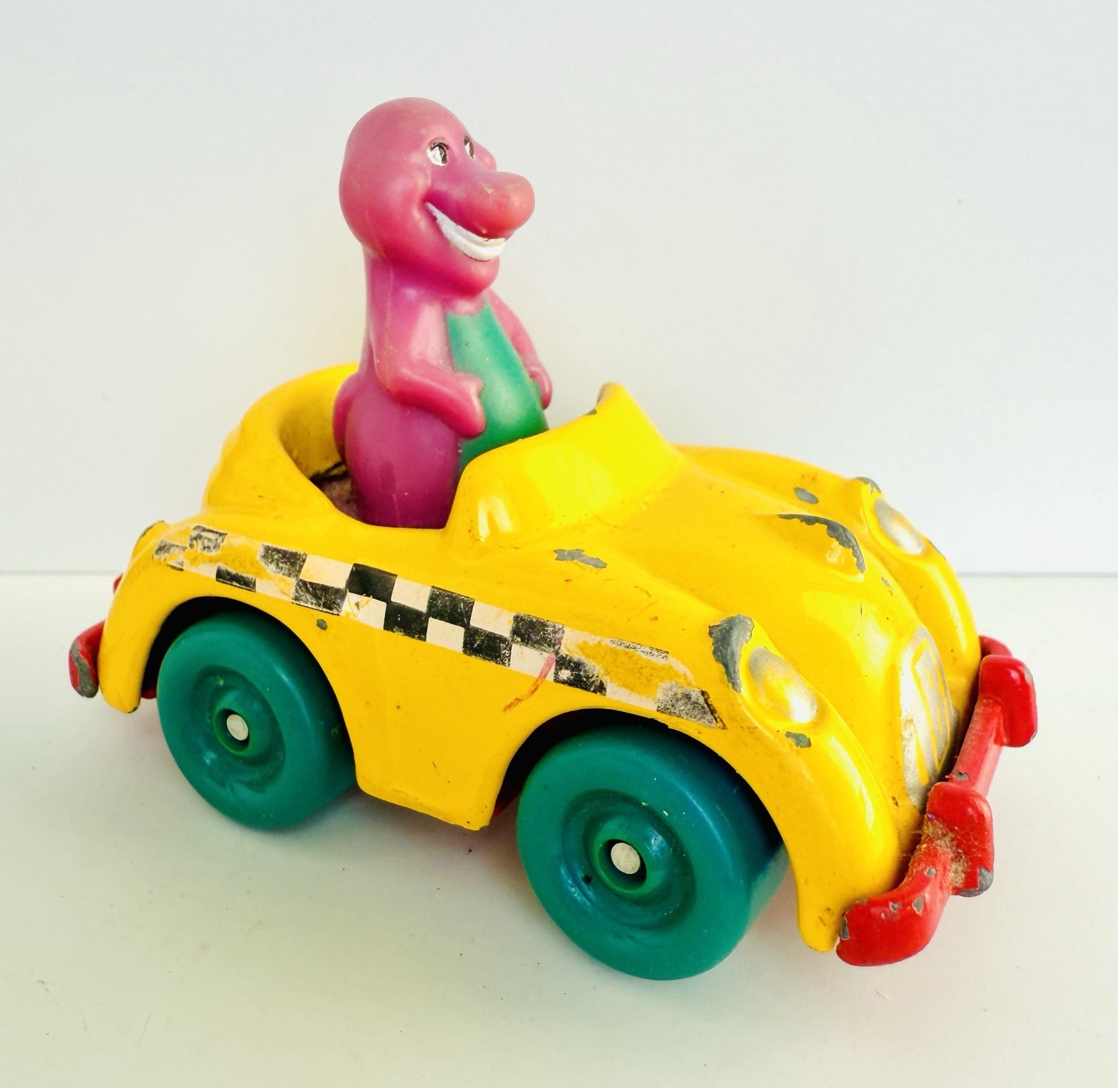 1993 Barney The Purple Dinosaur Driving a Yellow Taxi Toy Car The Lyons Group