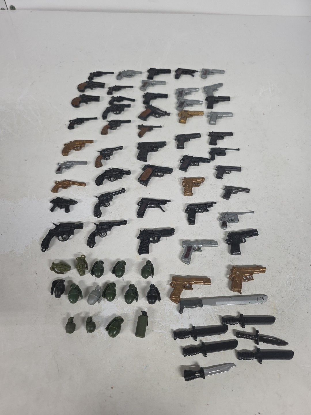 Lot of 21st Century Toys Weapons GI Joe Handguns/Knives/Grenades – Lot Of 70