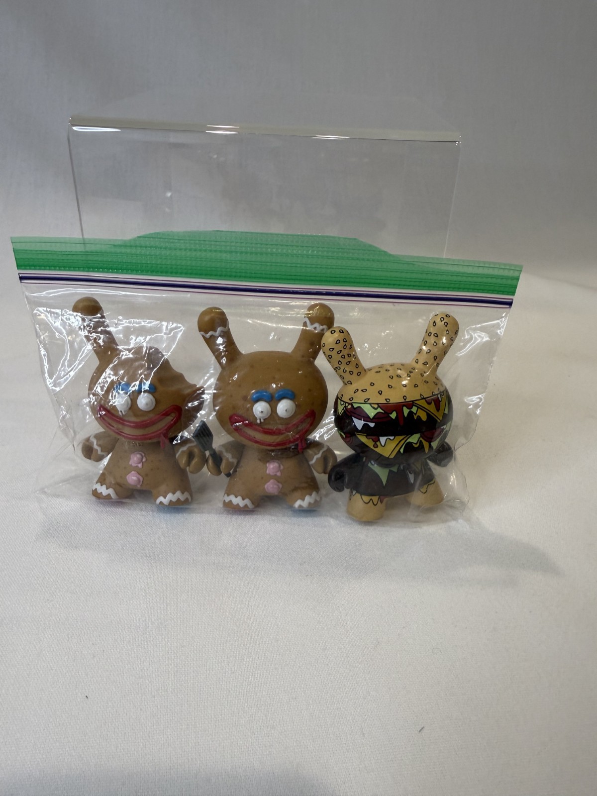 Kidrobot – Kronk Gingerman Dunny, Set of 2 – Normal & Bitten Chase Version RARE!