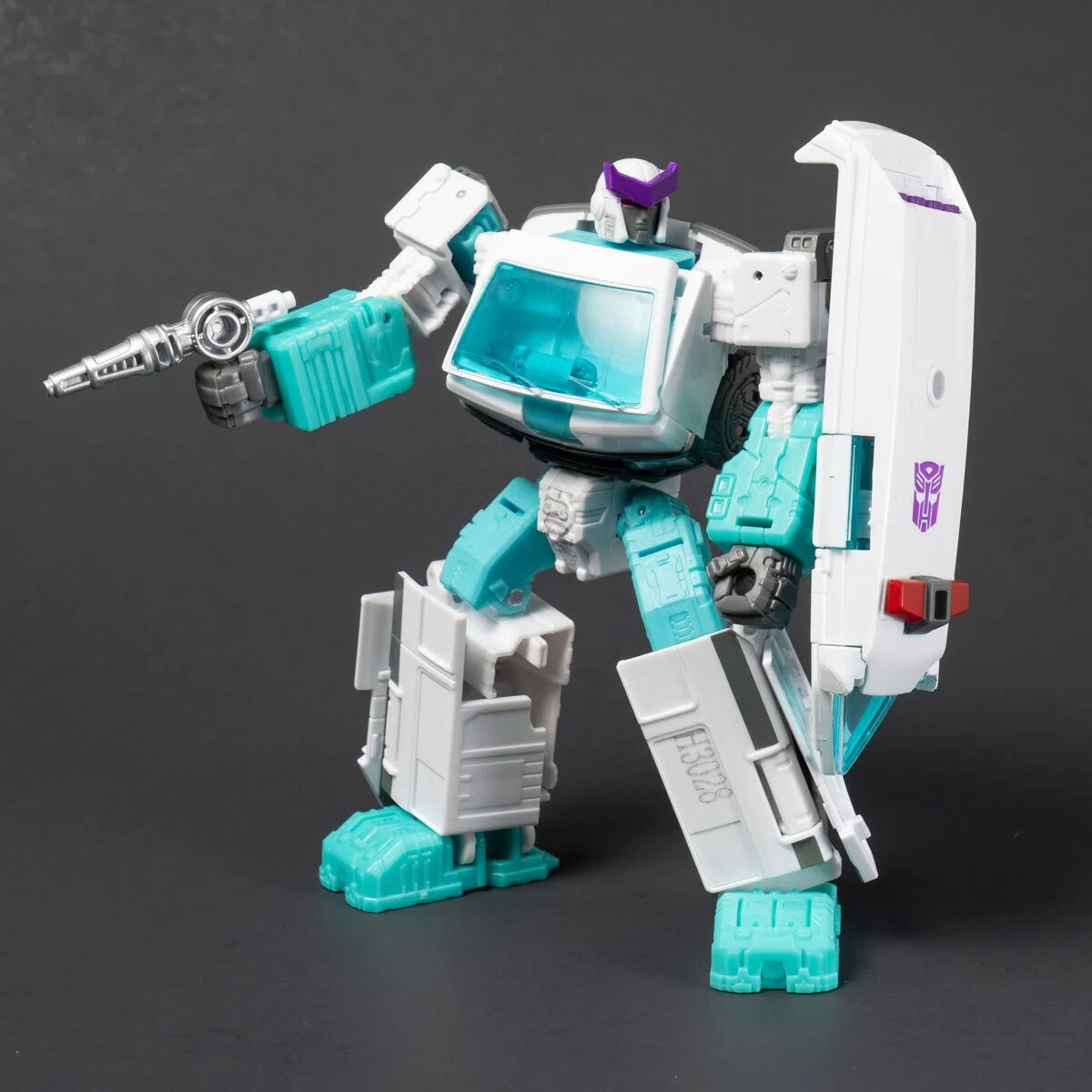 Transformers Generations Selects Shattered Glass Optimus Prime & Ratchet in hand