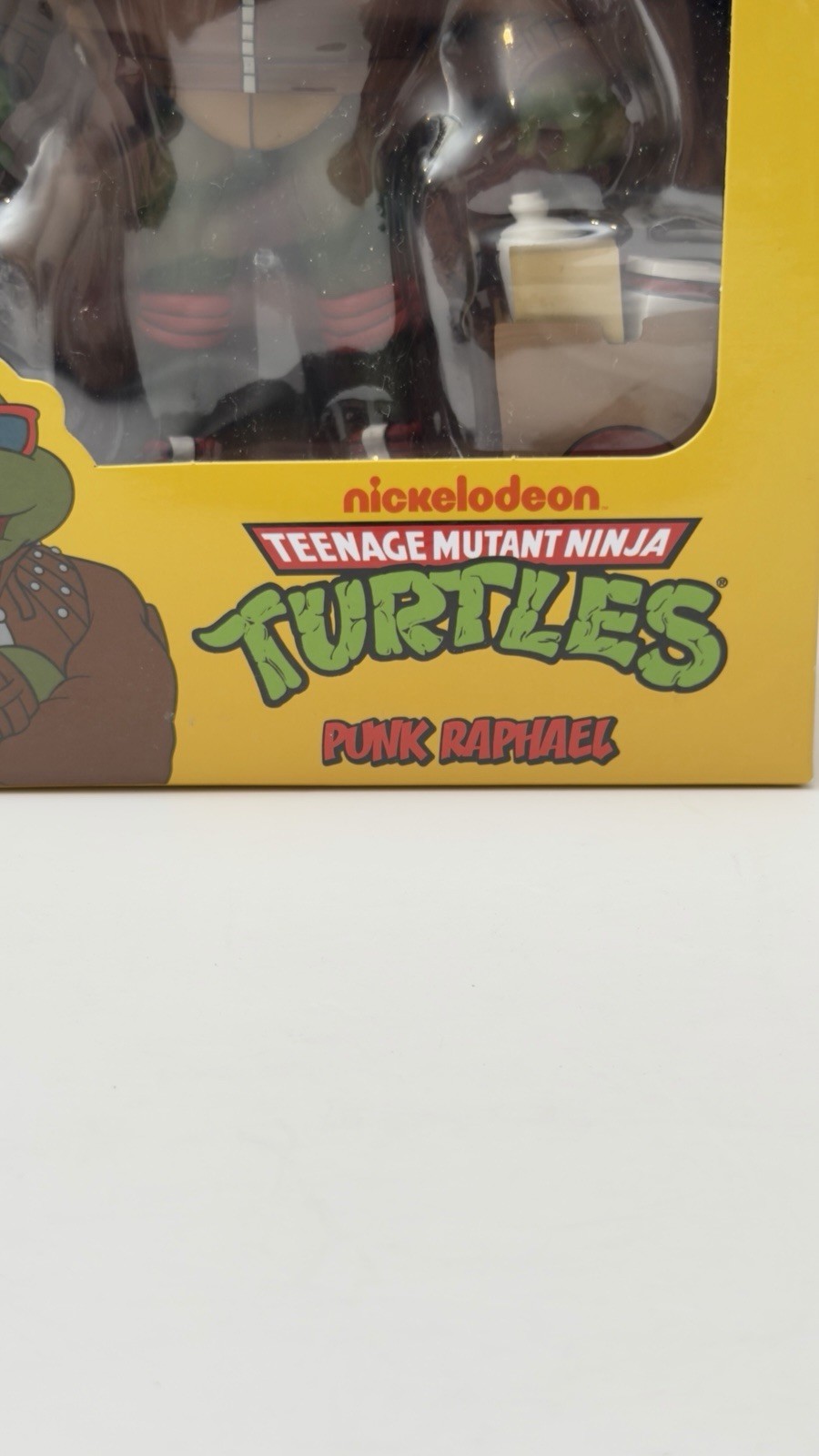 NECA TMNT Punk Raphael Action Figure, Green/Brown/Red w/ Heads Hands Bag