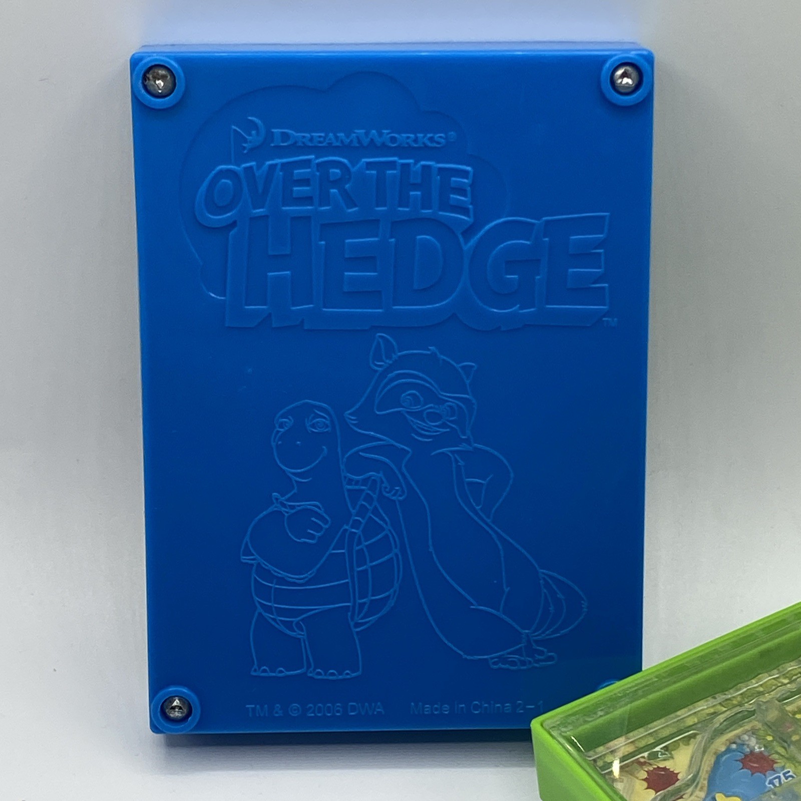 UIVERSAL STUDIOS CURIOUS GEORGE Monkey Maze Handheld Game & Over The Hedge