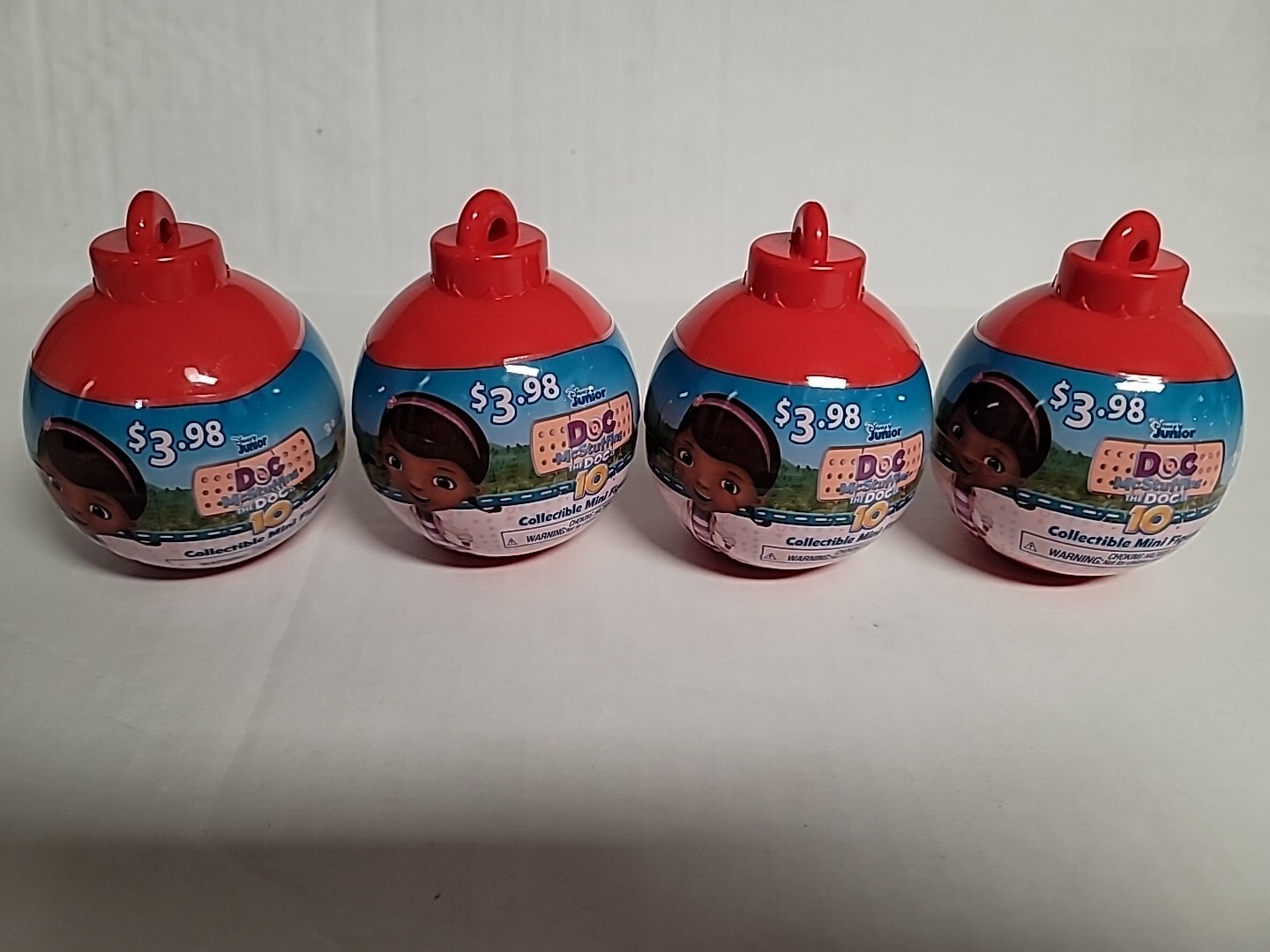 4~DISNEY JUNIOR DOC MCSTUFFIN PLASTIC ORNAMENT WITH MYSTERY MINI FIGURINE