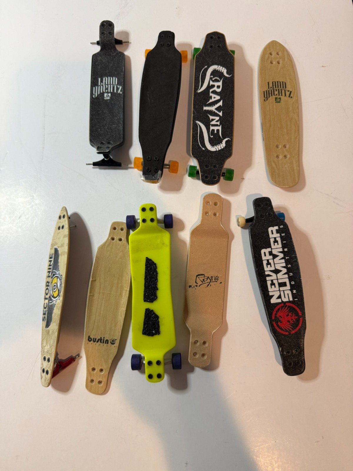 Various Brands Miniature Skateboard Finger Longboards Landyachtz – (Lot of 9)