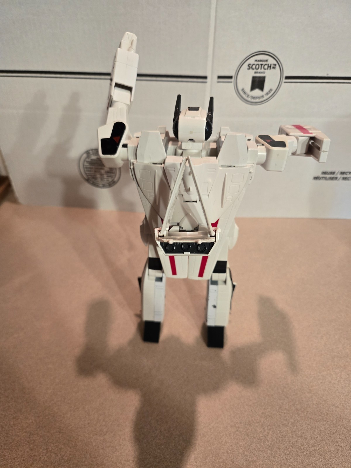 Vintage 1985 Transformers G1 Jetfire figure with accessory pieces.