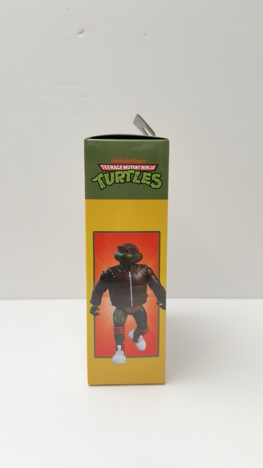 NECA TMNT Punk Raphael Action Figure, Green/Brown/Red w/ Heads Hands Bag