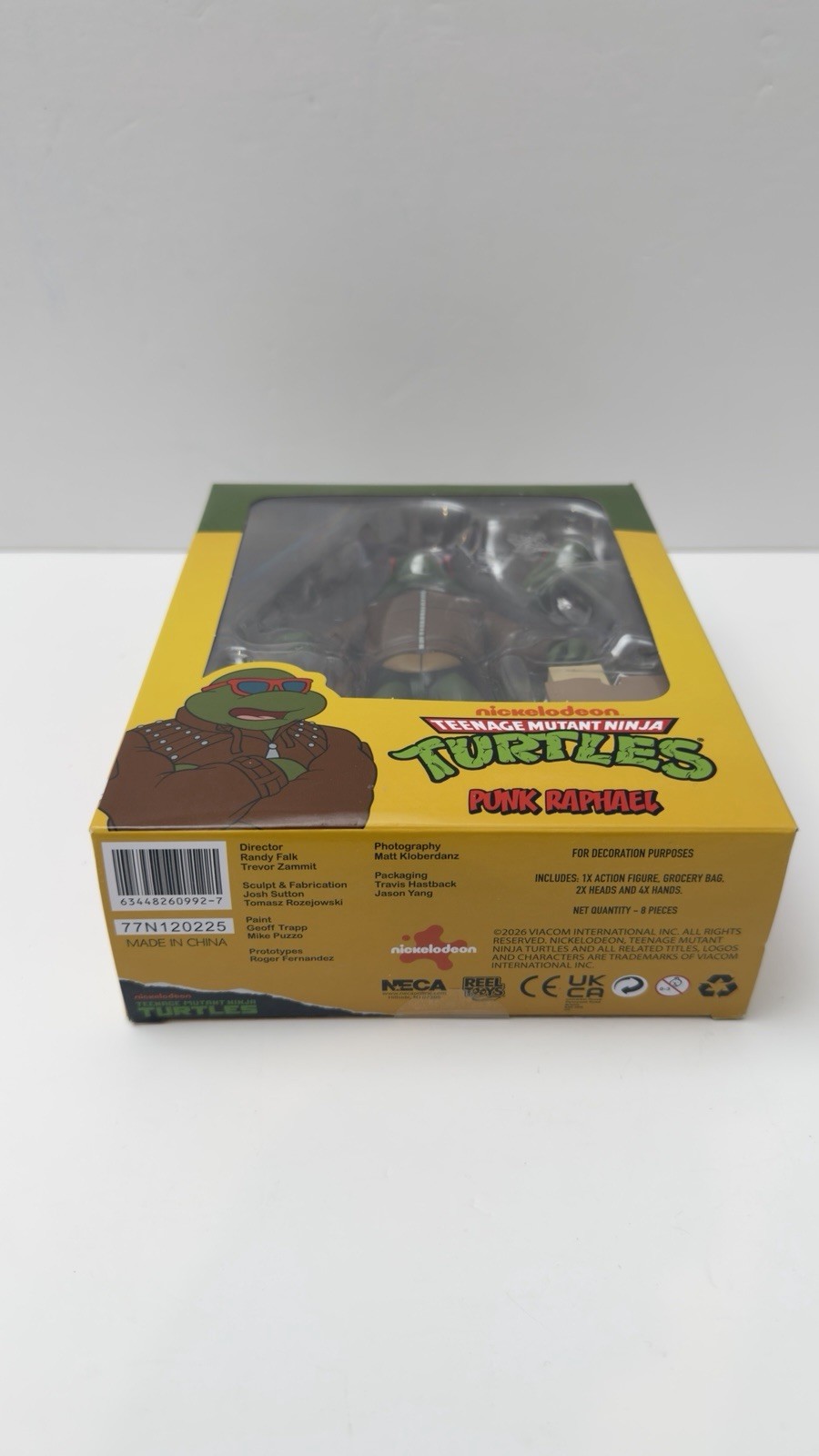 NECA TMNT Punk Raphael Action Figure, Green/Brown/Red w/ Heads Hands Bag
