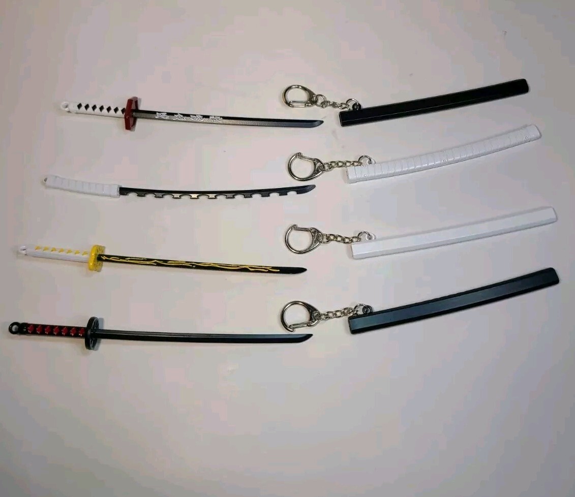 Lot Of 4 Action Figure Toy Swords Keychains