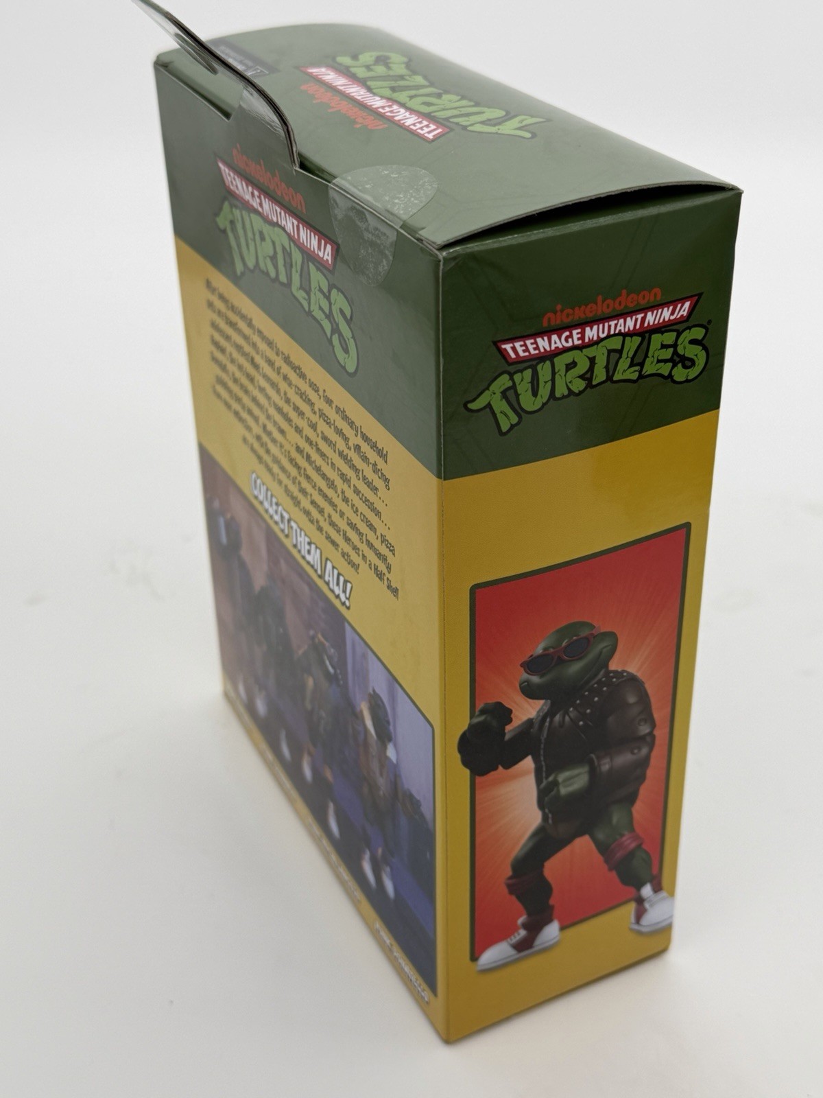 NECA TMNT Punk Raphael Action Figure, Green/Brown/Red w/ Heads Hands Bag