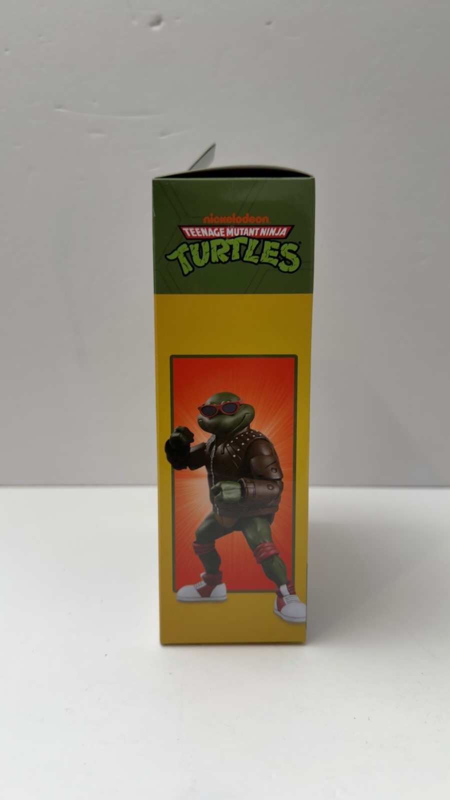 NECA TMNT Punk Raphael Action Figure, Green/Brown/Red w/ Heads Hands Bag