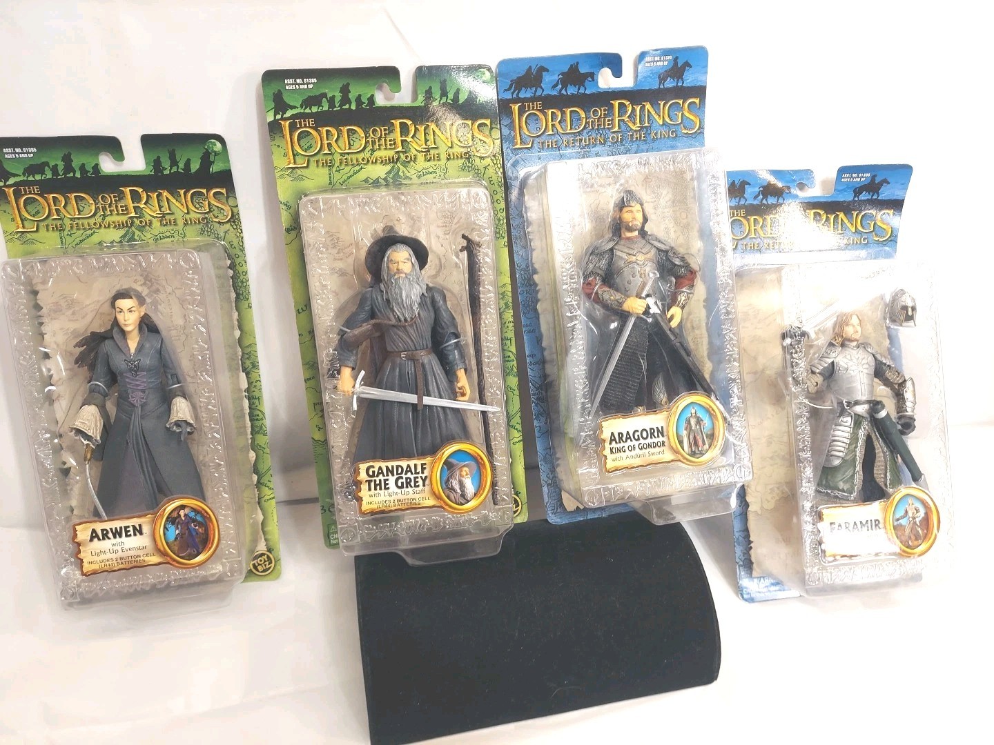 Lot of four board of the ring action figures