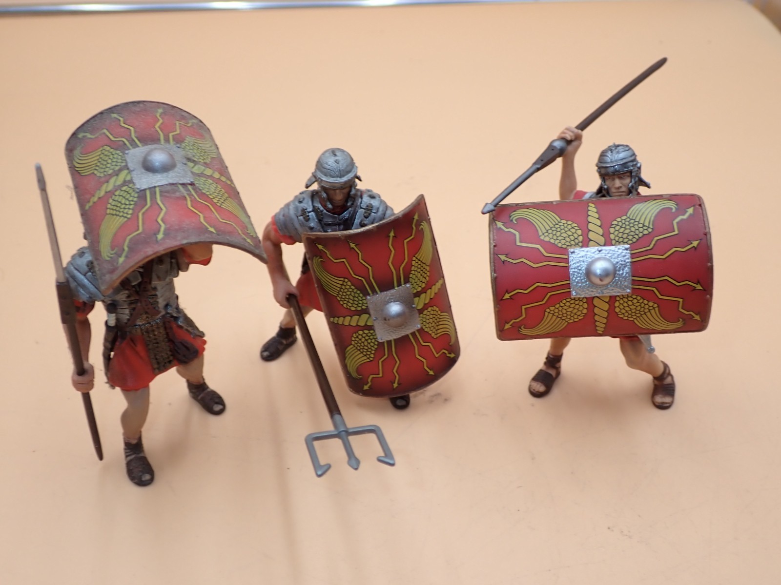 Blue Box Red Roman Soldiers with weapons about 4 » tall Plastic 2005