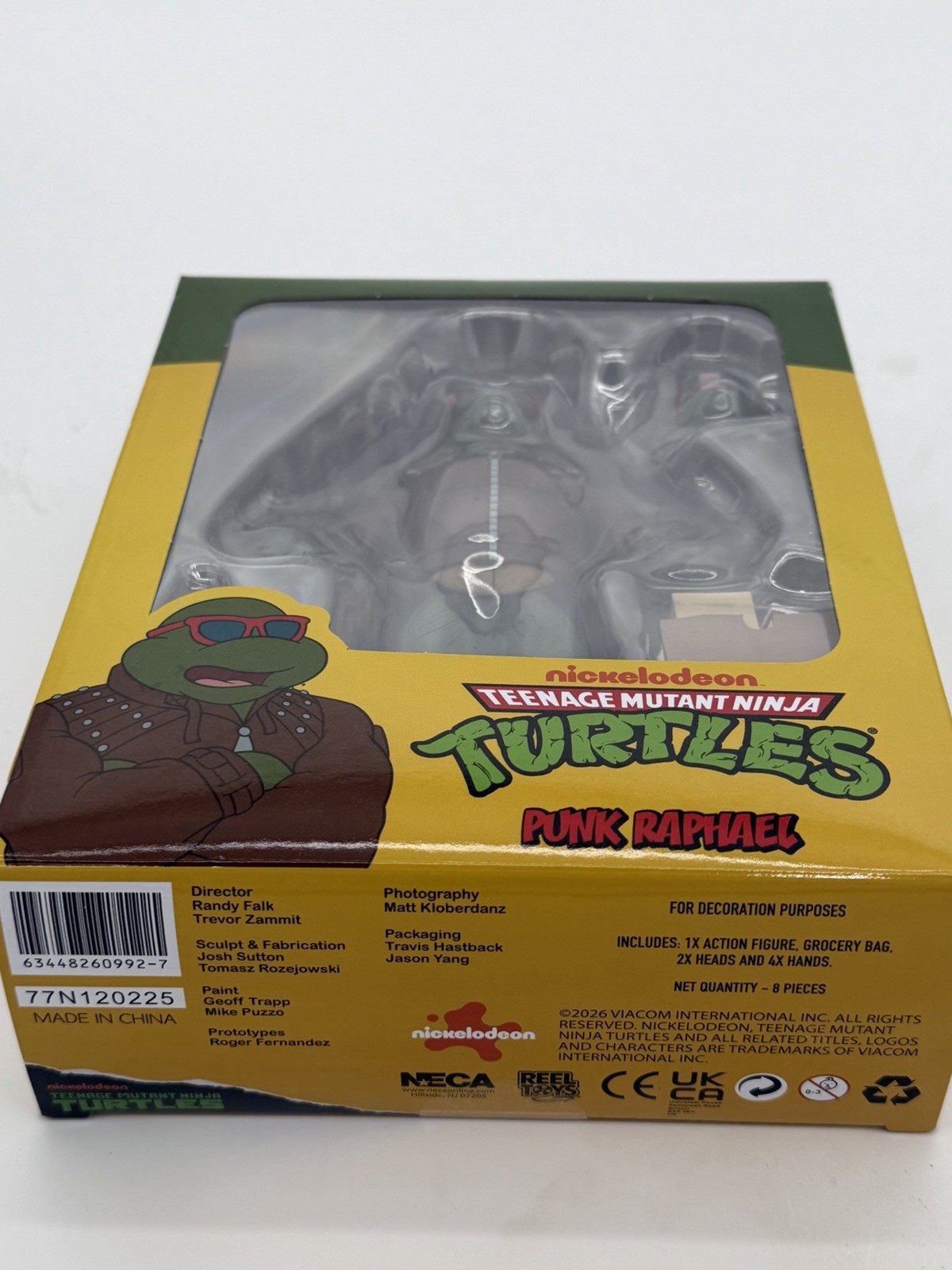 NECA TMNT Punk Raphael Action Figure, Green/Brown/Red w/ Heads Hands Bag