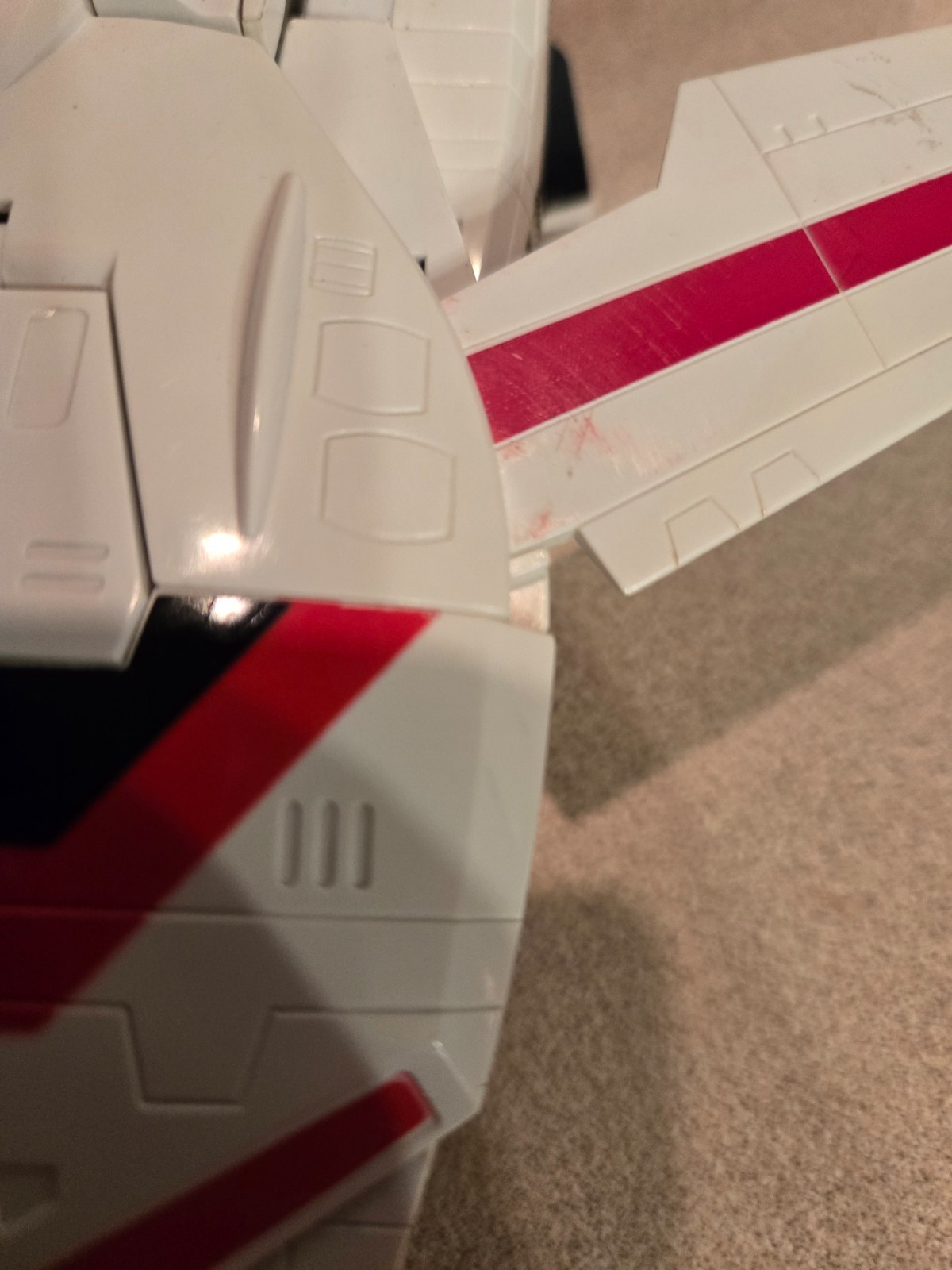 Vintage 1985 Transformers G1 Jetfire figure with accessory pieces.