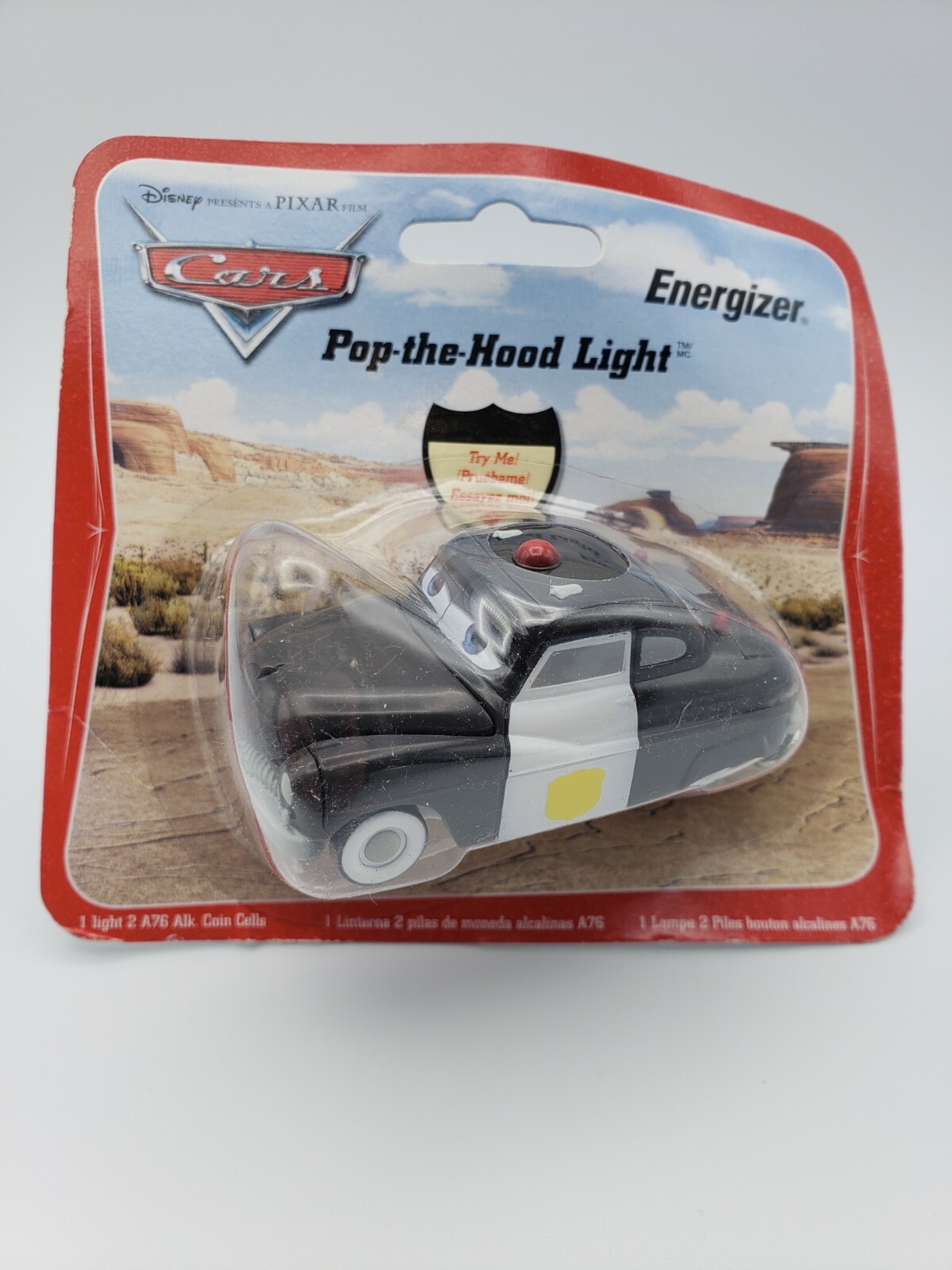 Disney Cars Sherrif Pop the Hood flashlight Light Energizer Keychain from 2006!!