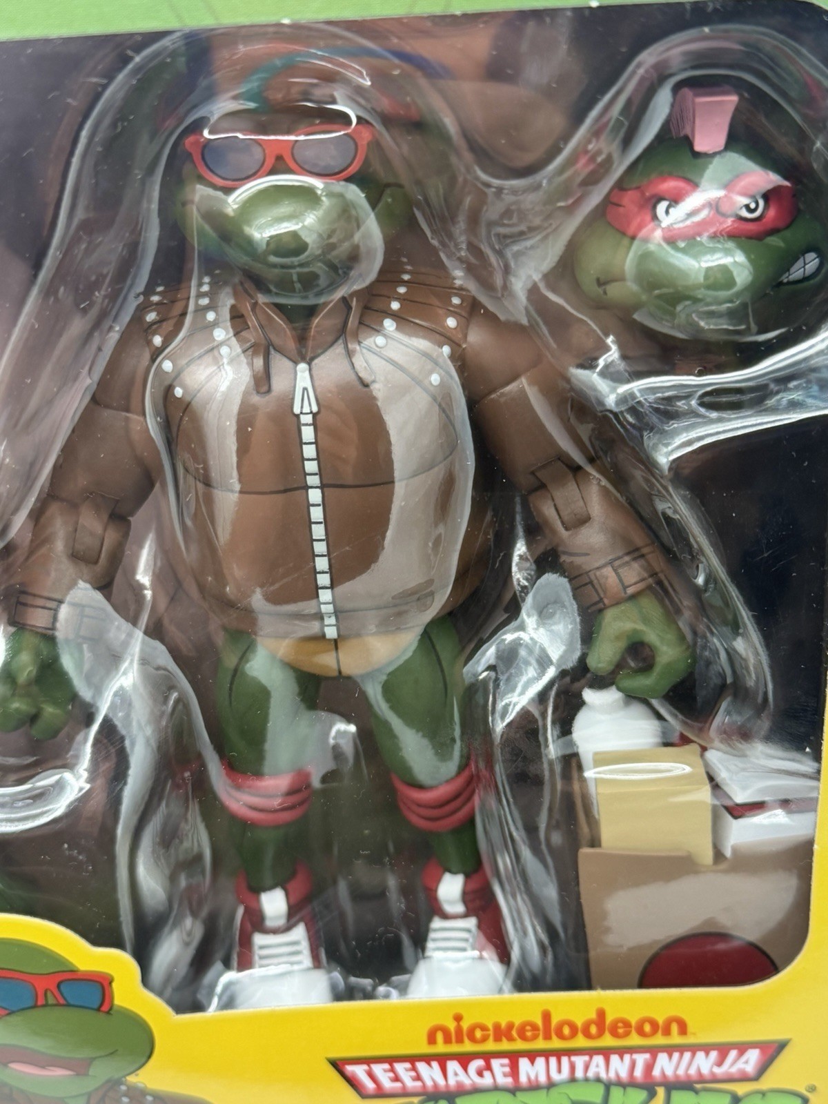 NECA TMNT Punk Raphael Action Figure, Green/Brown/Red w/ Heads Hands Bag