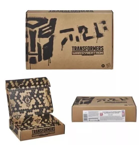 Transformers Generations Selects Shattered Glass Optimus Prime & Ratchet in hand