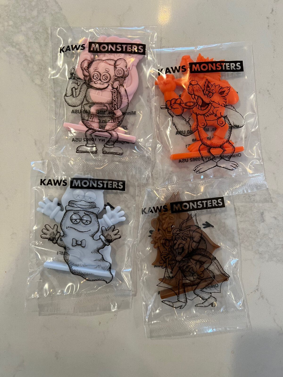 KAWS Monsters Figures Set of Four Sealed, In Hand: Count Chocula, Boo Berry, Etc