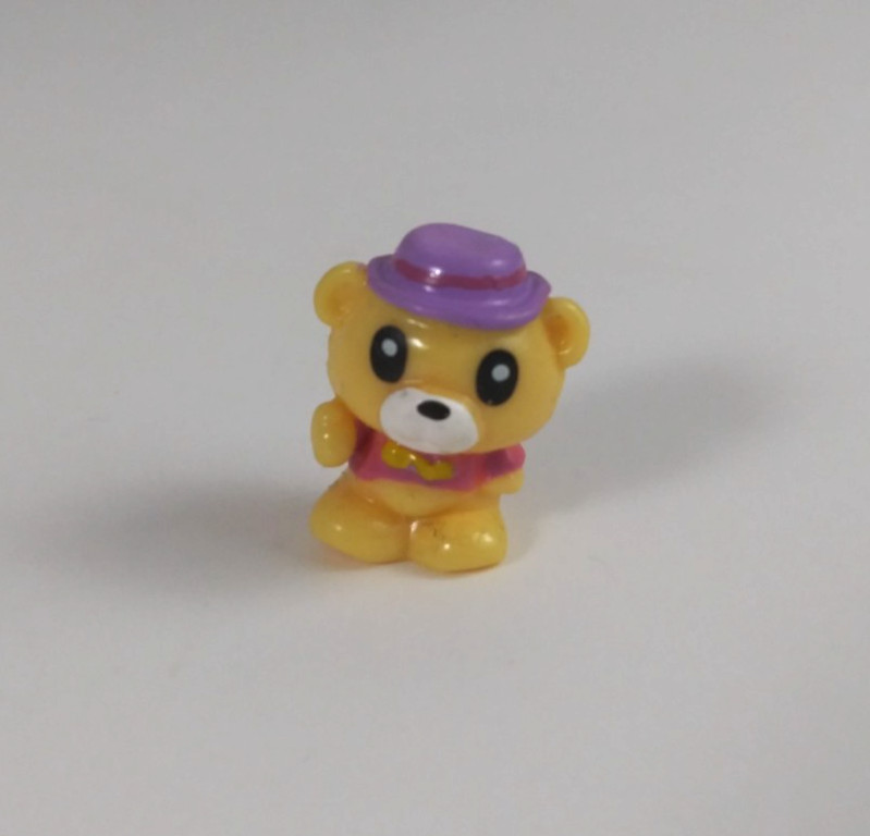 Squinkies Originals Wave 1 Yellow Bear Wearing Pink Shirt & Purple Hat