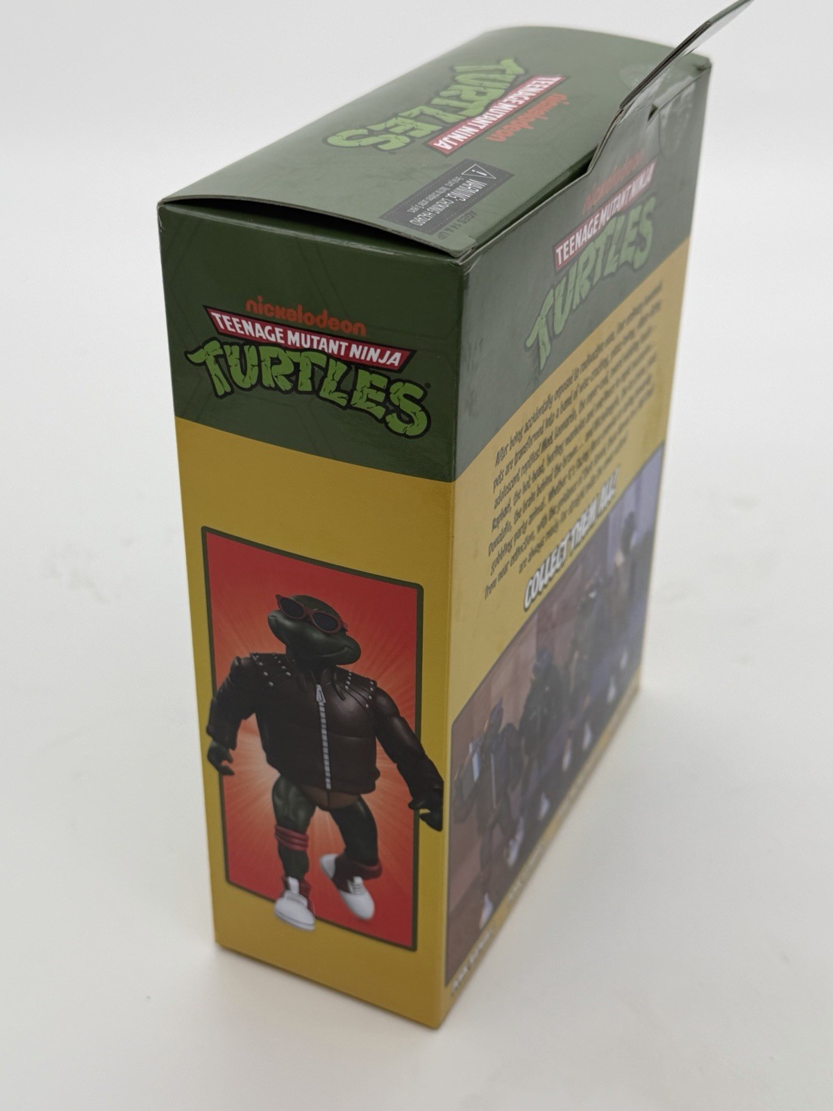 NECA TMNT Punk Raphael Action Figure, Green/Brown/Red w/ Heads Hands Bag